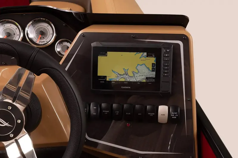 Slide: The Image of 2025 SunCatcher Fusion 324RCX dashboard with Garmin navigation and control panel. - 13