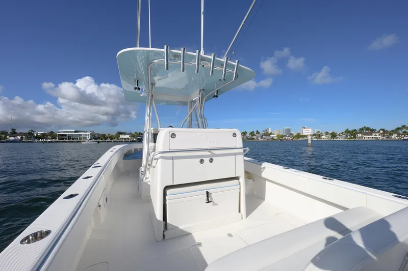 Slide: The Image of 2022 SeaVee 340Z boat on water, clear sky, coastal view. - 11