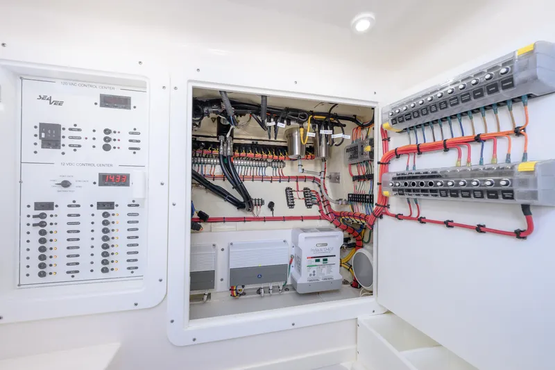 Slide: The Image of Electrical control panel of 2022 SeaVee 340Z boat, showcasing wiring and components. - 16