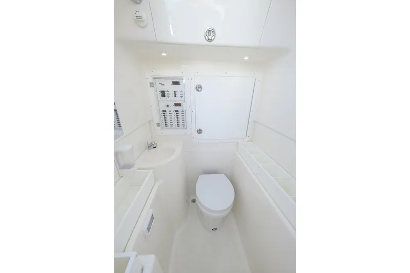 Slide: The Image of 2022 SeaVee 340Z boat interior bathroom with modern fixtures and control panel. - 15