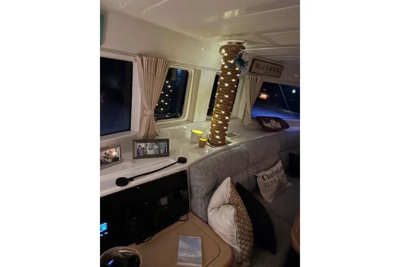 Slide: The Image of Interior of 2008 Lagoon 420 yacht with cozy seating and decorative lighting. - 10