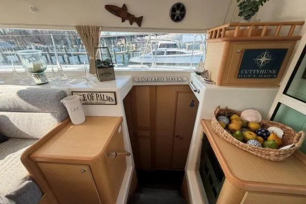 Slide: The Image of Interior of 2008 Lagoon 420 yacht with cozy decor and fruit basket. - 11