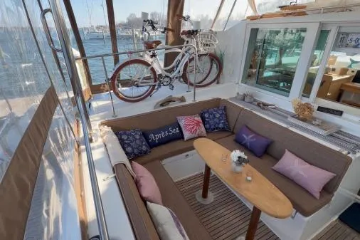Slide: The Image of Cozy seating area on 2008 Lagoon 420 yacht with decorative pillows and bicycle. - 35