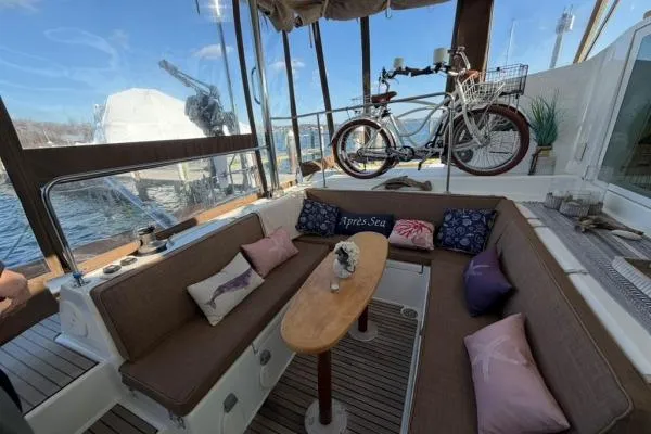 Slide: The Image of Cozy Lagoon 420 yacht interior with seating, table, and bicycle, 2008 model. - 37