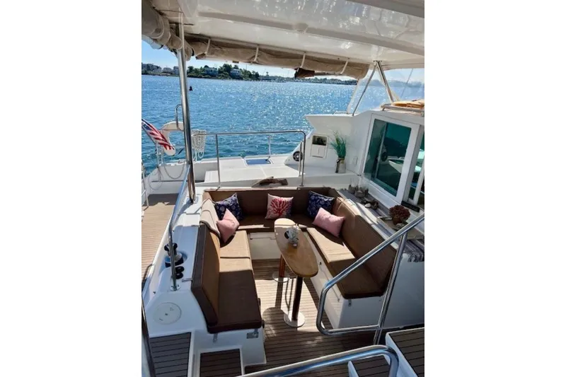 Slide: The Image of Luxurious 2008 Lagoon 420 yacht with cozy outdoor seating and scenic ocean view. - 38