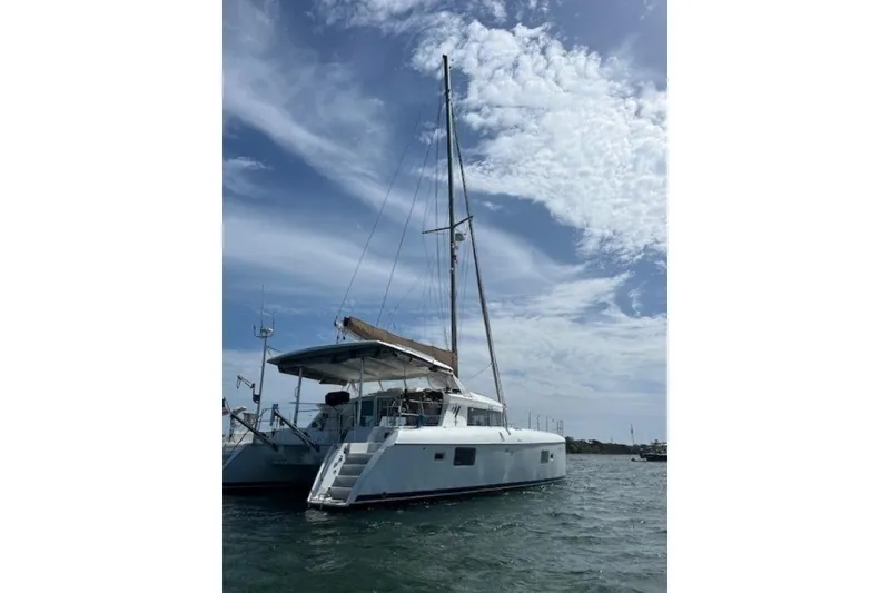 Slide: The Image of 2008 Lagoon 420 catamaran sailing on a sunny day with cloudy sky. - 51
