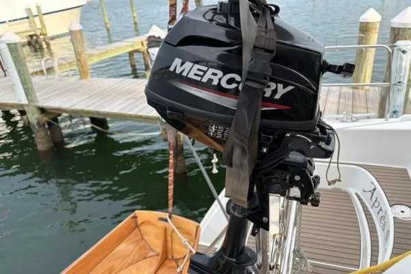 Slide: The Image of Mercury outboard motor on Lagoon 420 catamaran, docked by the water, 2008 model. - 59