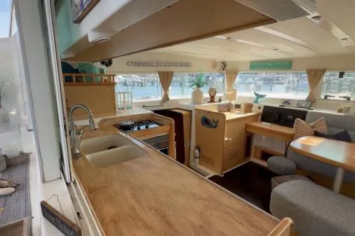 Slide: The Image of Interior of 2008 Lagoon 420 catamaran with modern kitchen and cozy seating area. - 6