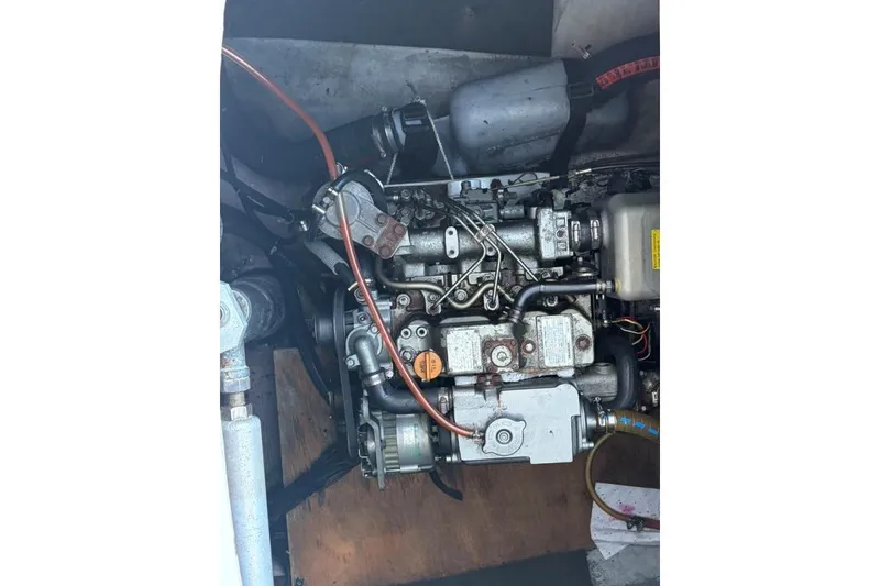 Slide: The Image of Engine of a 2008 Lagoon 420 catamaran, showcasing intricate mechanical components. - 61