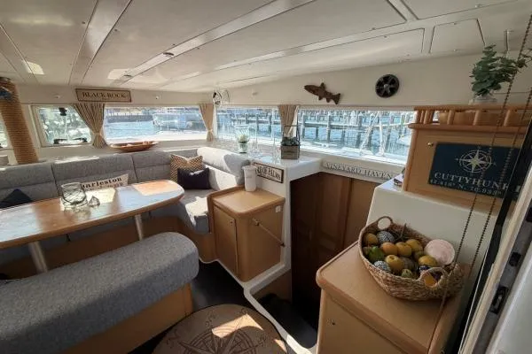 Slide: The Image of Interior of a 2008 Lagoon 420 yacht with cozy seating and nautical decor. - 7