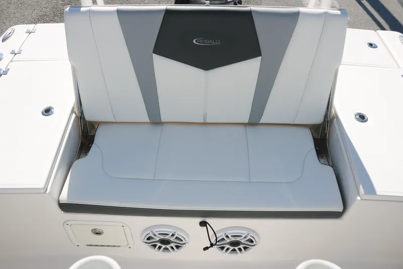 Slide: The Image of 2024 Robalo 226 Cayman boat seat with integrated speakers and storage compartment. - 12