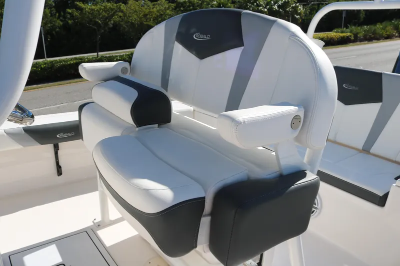 Slide: The Image of 2024 Robalo 226 Cayman boat seat with cushioned armrests and sleek design. - 9