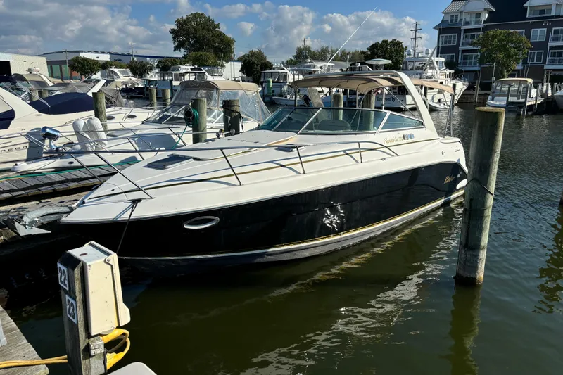 Slide: The Image of 2005 Rinker Fiesta Vee 300 boat bathroom with sink, toilet, and window. - 3