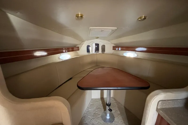 Slide: The Image of 2005 Rinker Fiesta Vee 300 boat docked in a marina, sunny day. - 7