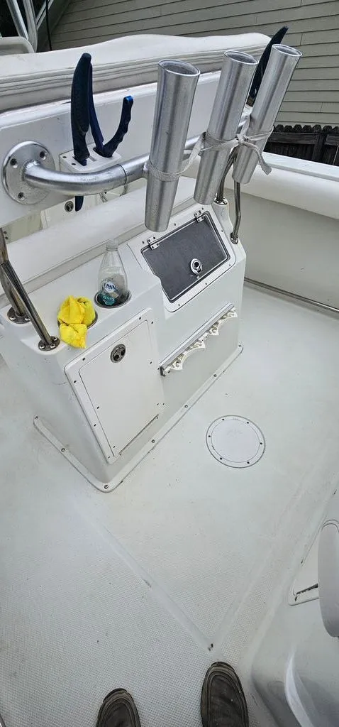 Slide: The Image of Interior of a 2008 Sailfish 2360 CC boat with fishing rod holders. - 19