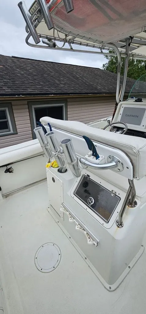 Slide: The Image of 2008 Sailfish 2360 CC boat console with fishing rod holders. - 20