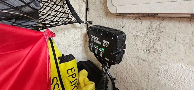 Slide: The Image of NOCO Genius GEN5X3 charger in a 2008 Sailfish 2360 CC. - 27