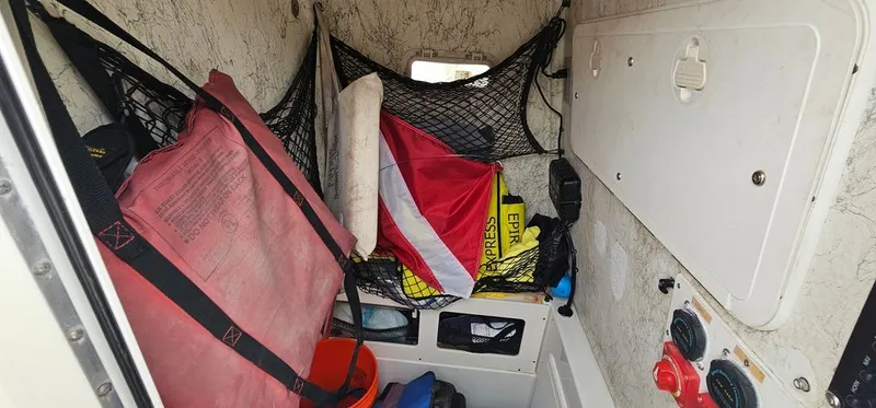 Slide: The Image of Interior of a 2008 Sailfish 2360 CC with safety equipment. - 28