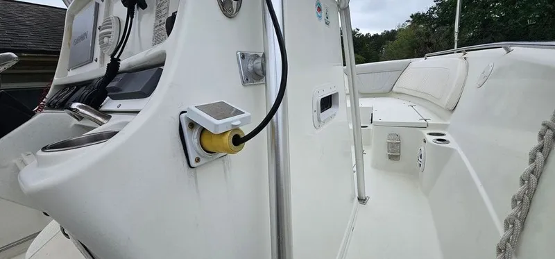 Slide: The Image of Interior view of 2008 Sailfish 2360 CC boat, helm console and seating area. - 41