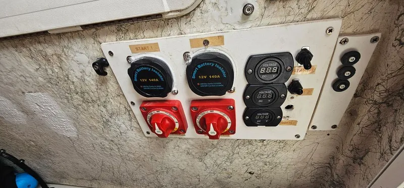 Slide: The Image of Battery and voltage panel on a 2008 Sailfish 2360 CC boat. - 42