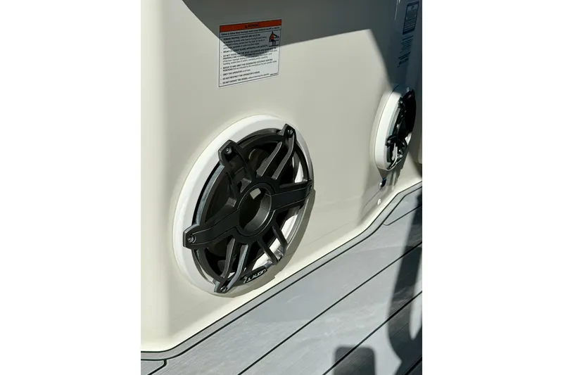 Slide: The Image of 2024 Boston Whaler 360 Outrage boat speakers with JL Audio branding. - 31