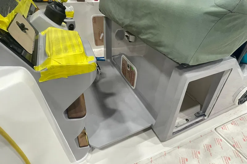 Slide: The Image of 2024 Boston Whaler 360 Outrage boat interior with protective coverings and equipment. - 61