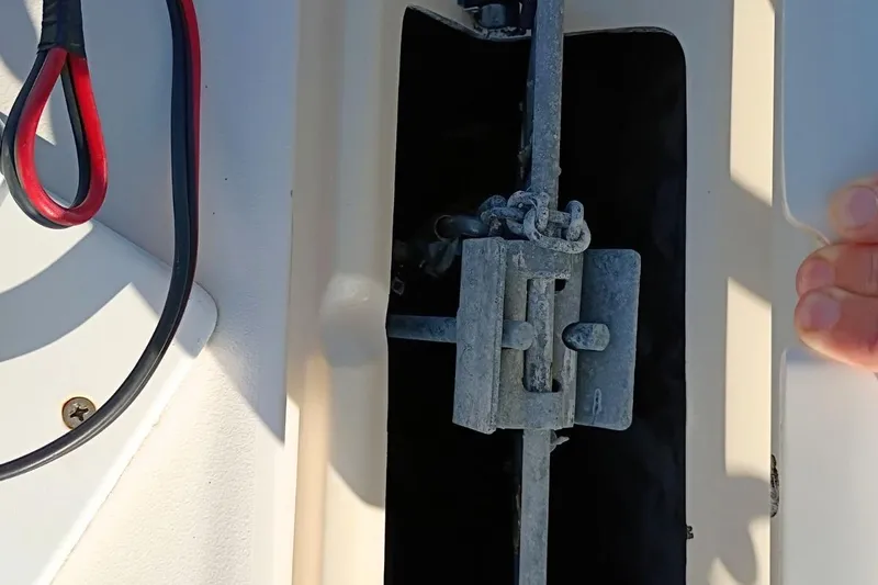 Slide: The Image of Anchor storage compartment on 2004 Grady-White Escape 209 boat. - 11