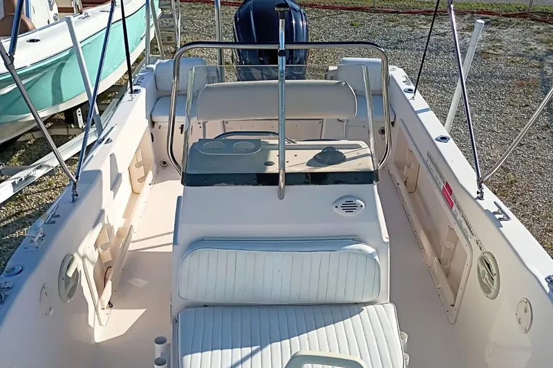 Slide: The Image of 2004 Grady-White Escape 209 boat interior with seating and steering console. - 12