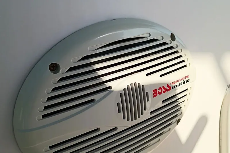 Slide: The Image of Marine speaker on 2004 Grady-White Escape 209 boat, featuring Boss Audio Systems branding. - 19