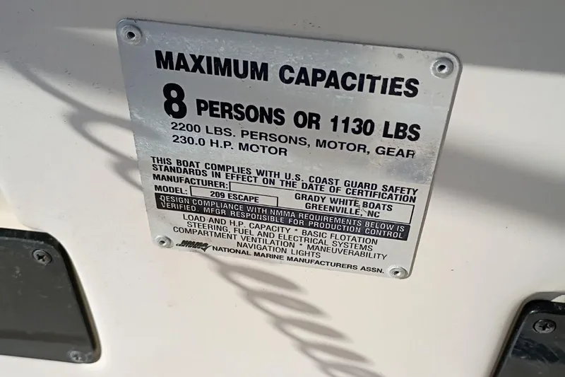 Slide: The Image of Capacity plate for 2004 Grady-White Escape 209, 8 persons or 1130 lbs, 230 HP motor. - 25