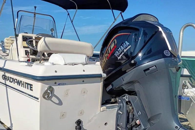Slide: The Image of 2004 Grady-White Escape 209 boat with Yamaha outboard motor, sunny day. - 26