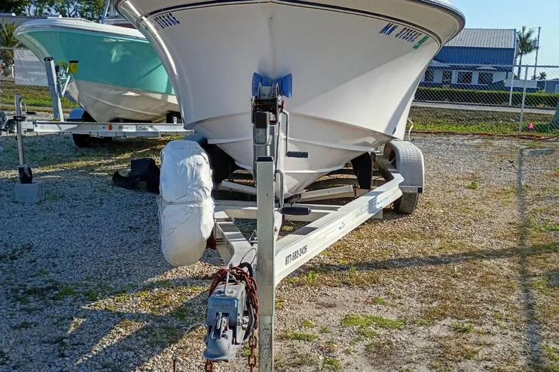 Slide: The Image of 2004 Grady-White Escape 209 boat on trailer in outdoor storage area. - 27