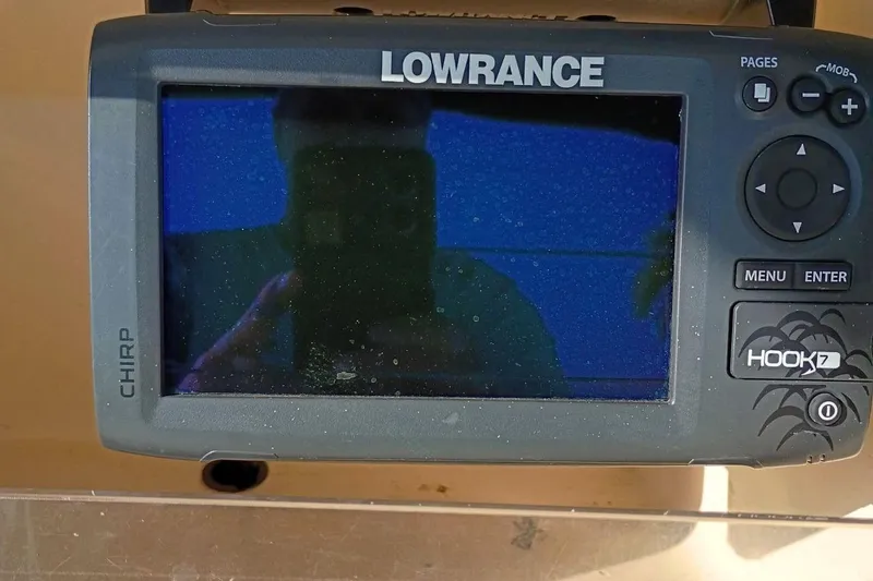 Slide: The Image of Lowrance Hook 7 fishfinder on 2004 Grady-White Escape 209 boat dashboard. - 6