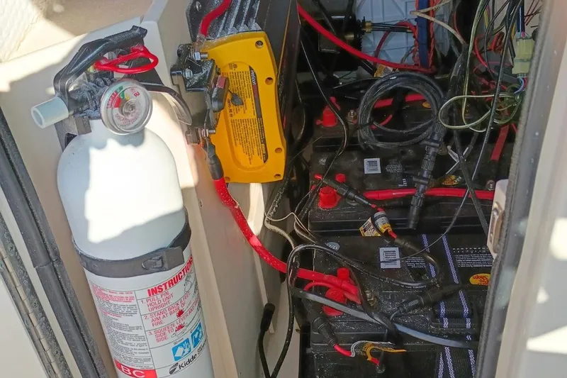 Slide: The Image of Fire extinguisher and battery setup in 2004 Grady-White Escape 209 boat. - 8