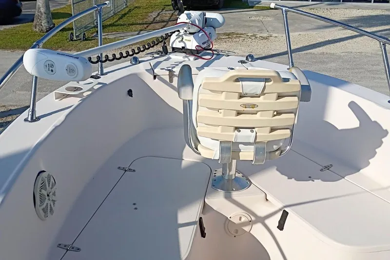 Slide: The Image of 2004 Grady-White Escape 209 boat interior with seating and steering console. - 9