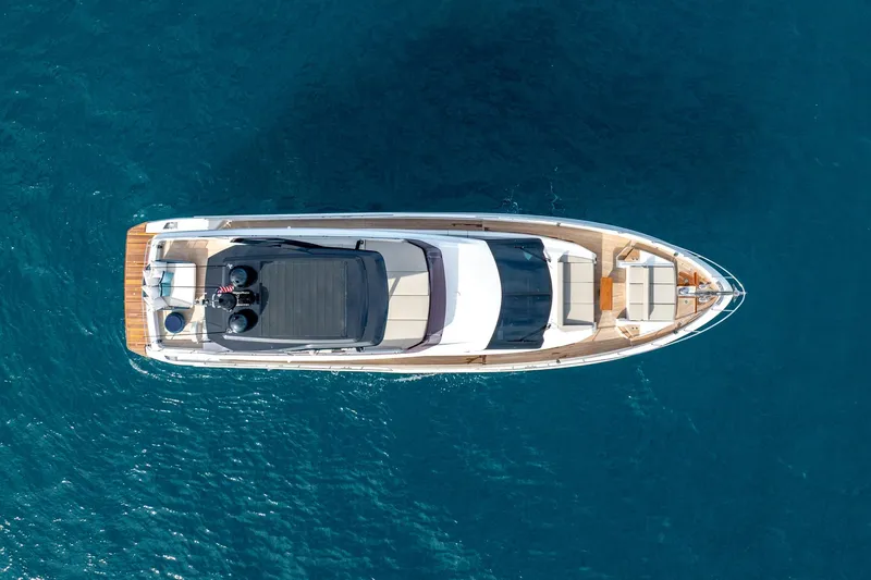 Slide: The Image of Aerial view of 2023 Ferretti Yachts 720 on clear blue water. - 10