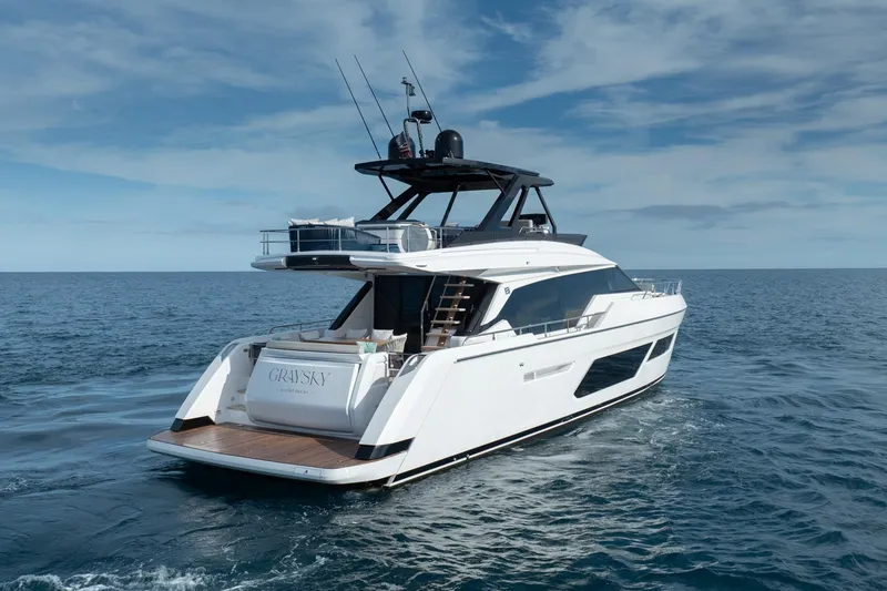 Slide: The Image of 2023 Ferretti Yachts 720 cruising on open sea under clear skies. - 12