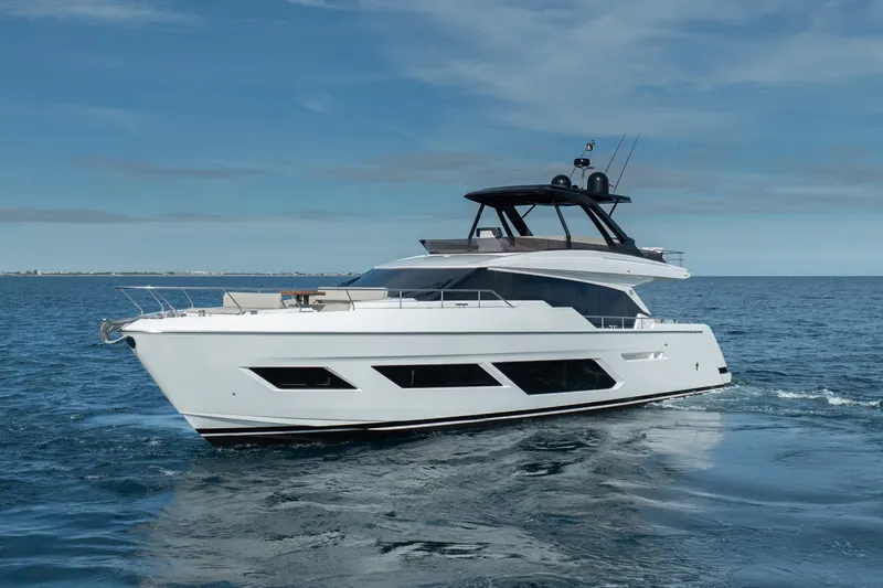 Slide: The Image of 2023 Ferretti Yachts 720 cruising on open sea under clear blue sky. - 13