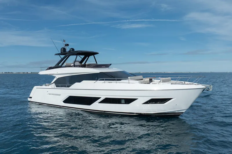 Slide: The Image of 2023 Ferretti Yachts 720 cruising on open water under clear blue skies. - 15