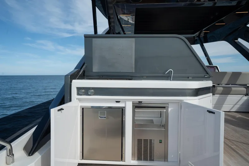 Slide: The Image of Outdoor kitchen on 2023 Ferretti Yachts 720, featuring stainless steel appliances and ocean view. - 17