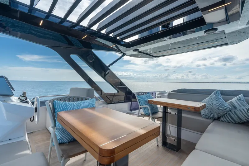 Slide: The Image of Luxurious 2023 Ferretti Yachts 720 deck with modern seating and ocean view. - 19