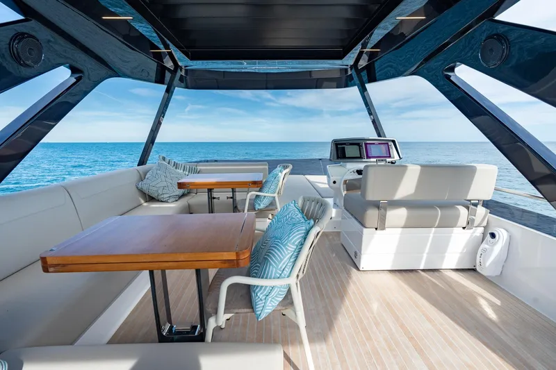 Slide: The Image of Luxurious 2023 Ferretti Yachts 720 interior with ocean view, featuring elegant seating and modern design. - 21