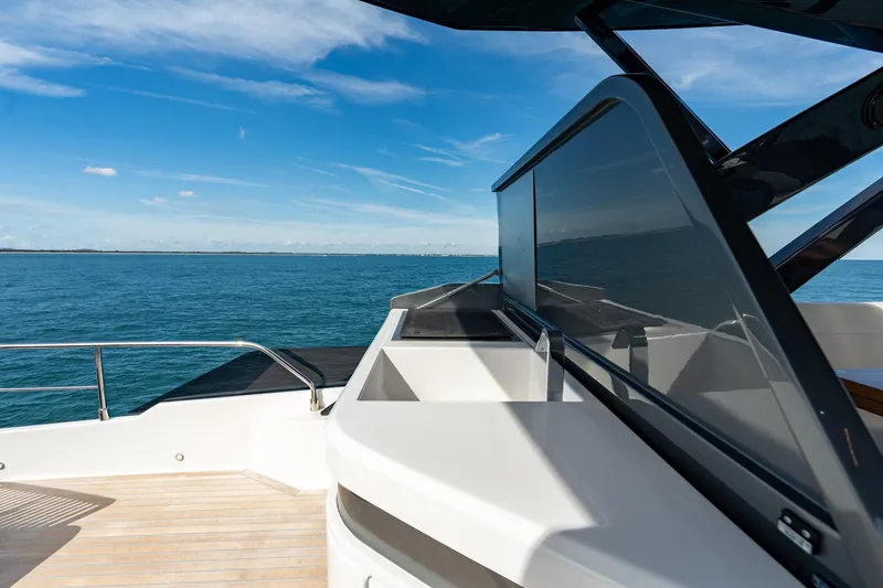 Slide: The Image of 2023 Ferretti Yachts 720 deck with ocean view and sleek design. - 23