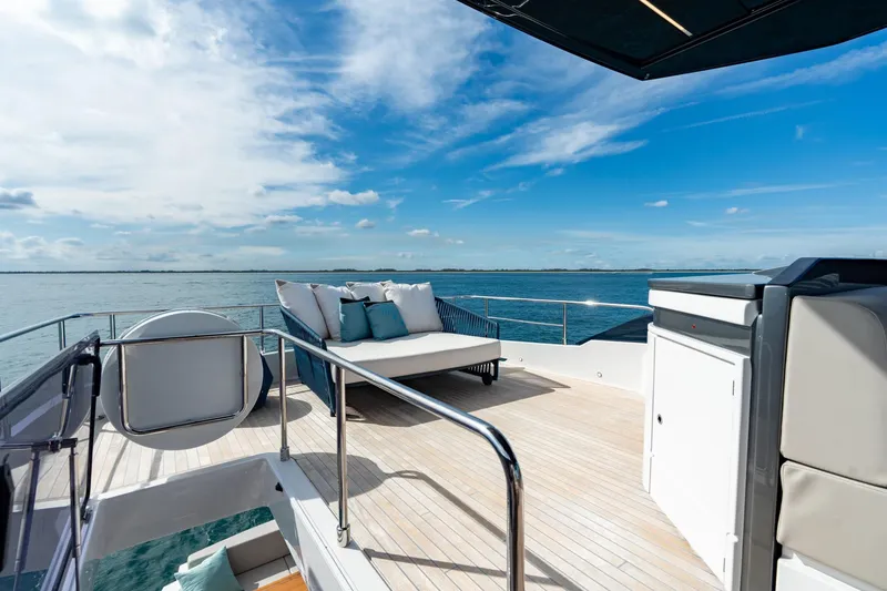 Slide: The Image of Luxurious deck of 2023 Ferretti Yachts 720 with ocean view and seating area. - 24
