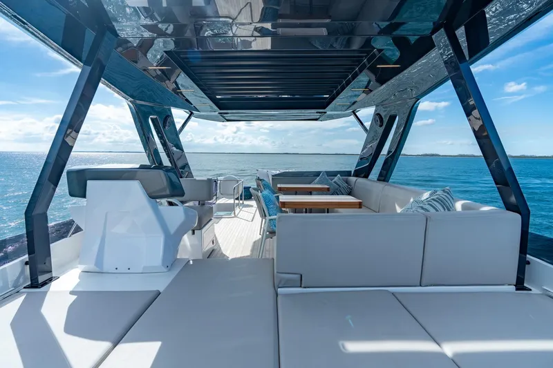 Slide: The Image of Luxurious 2023 Ferretti Yachts 720 deck with modern seating and ocean view. - 26