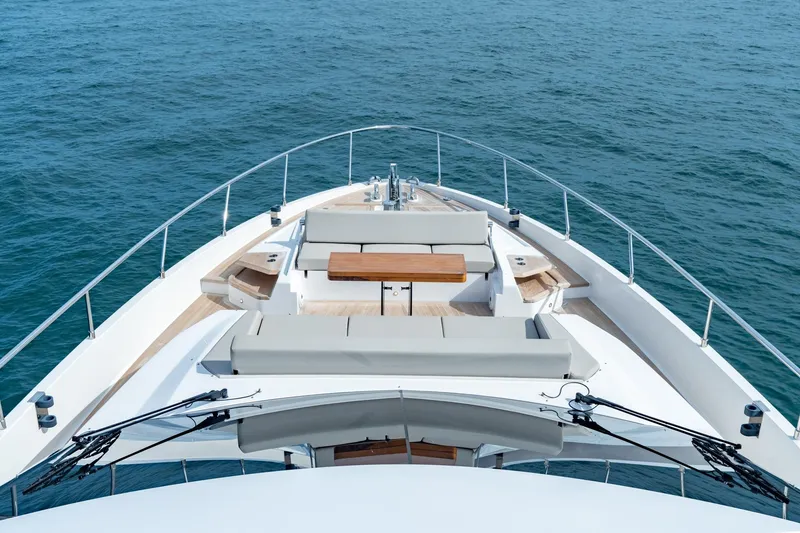 Slide: The Image of 2023 Ferretti Yachts 720 bow view with luxurious seating on open sea. - 28