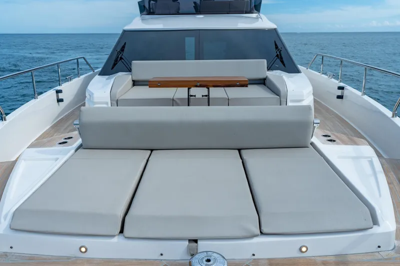 Slide: The Image of 2023 Ferretti Yachts 720 luxury deck with sun loungers and ocean view. - 32