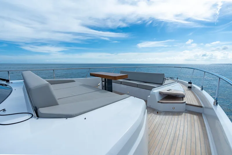 Slide: The Image of Luxurious 2023 Ferretti Yachts 720 deck with elegant seating and ocean view. - 33