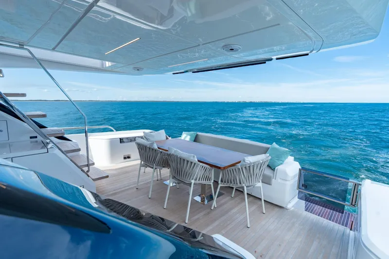 Slide: The Image of Luxurious 2023 Ferretti Yachts 720 deck with ocean view and elegant seating area. - 34