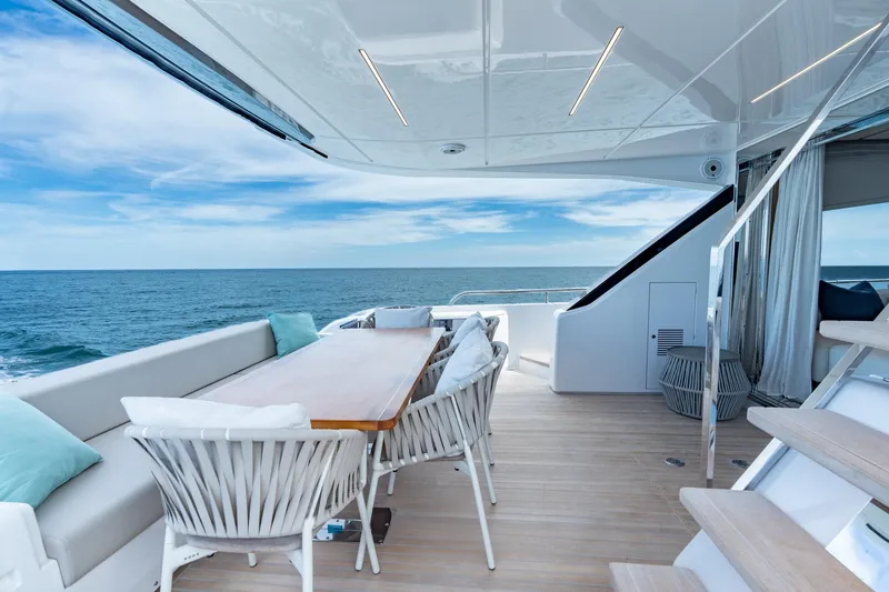 Slide: The Image of Luxurious 2023 Ferretti Yachts 720 deck with ocean view and elegant seating area. - 39